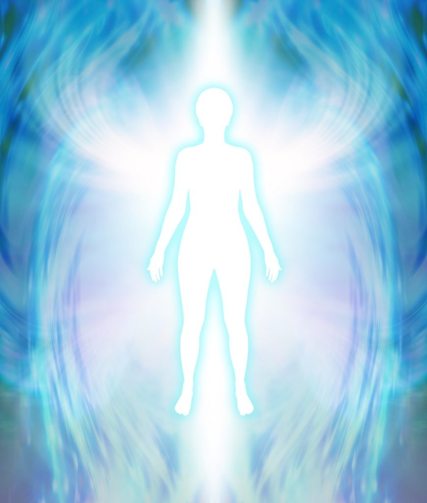 Silhouette of a person surrounded by a bright aura, with blue and white light swirling around, against a blurred background.