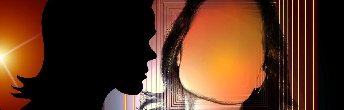 A silhouette of a woman symbolizing emotional trauma against a glowing background.