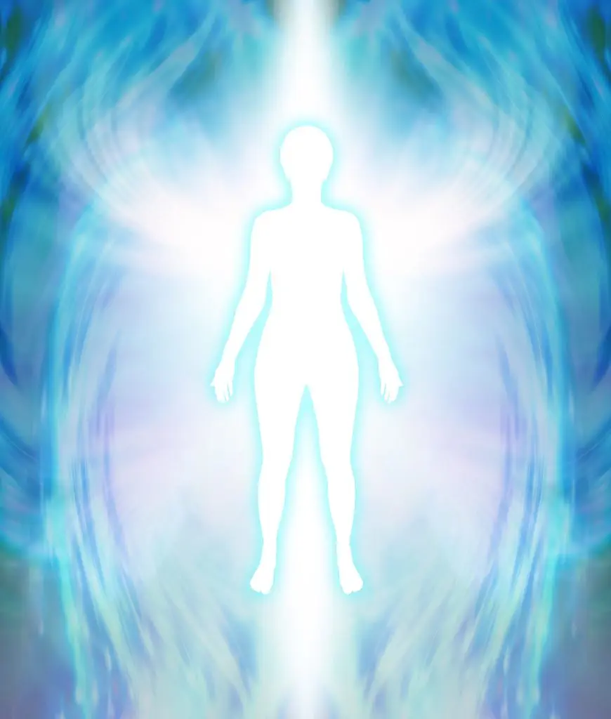 Silhouette of a person surrounded by a bright aura, with blue and white light swirling around, against a blurred background.