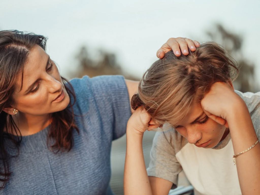 An empathic woman is showing care for this young person, while maintaining healthy boundaries